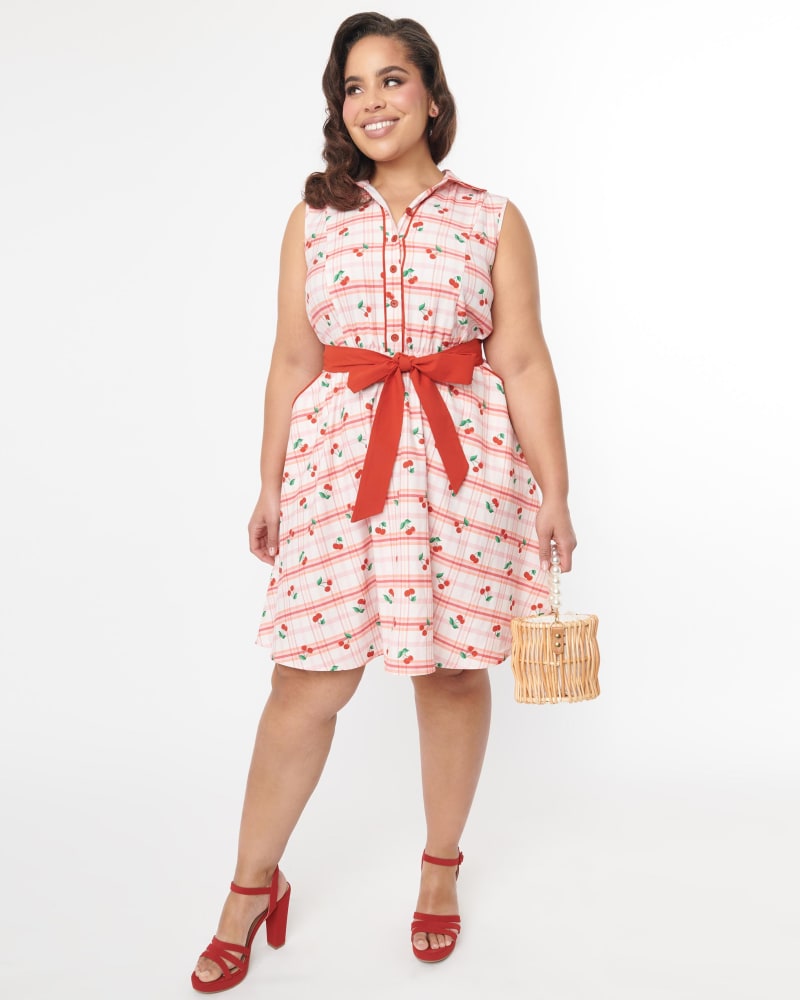 Front of a model wearing a size 2X Unique Vintage Curve 1950s Red & Cherry Plaid Flare Dress in White & Red Cherries by Unique Vintage. | dia_product_style_image_id:298558